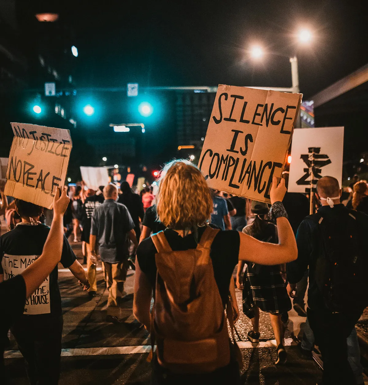 Young people protesting and carrying signs